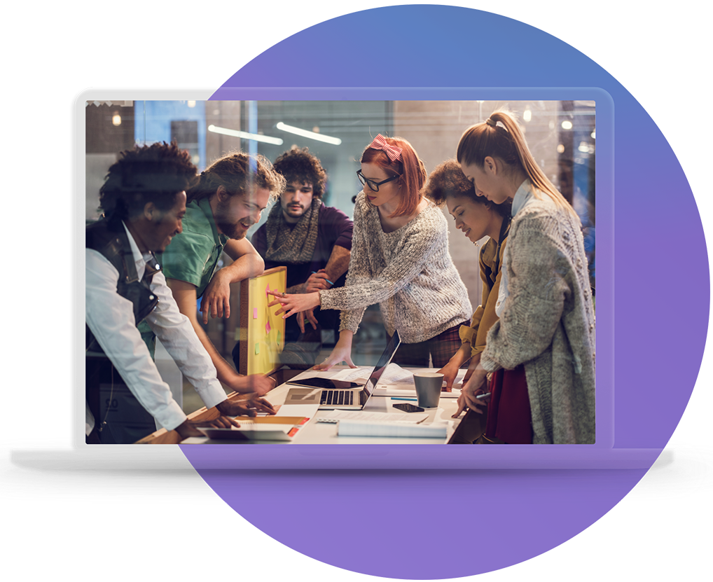 A cross-functional AICD team reviewing priorities together around a laptop